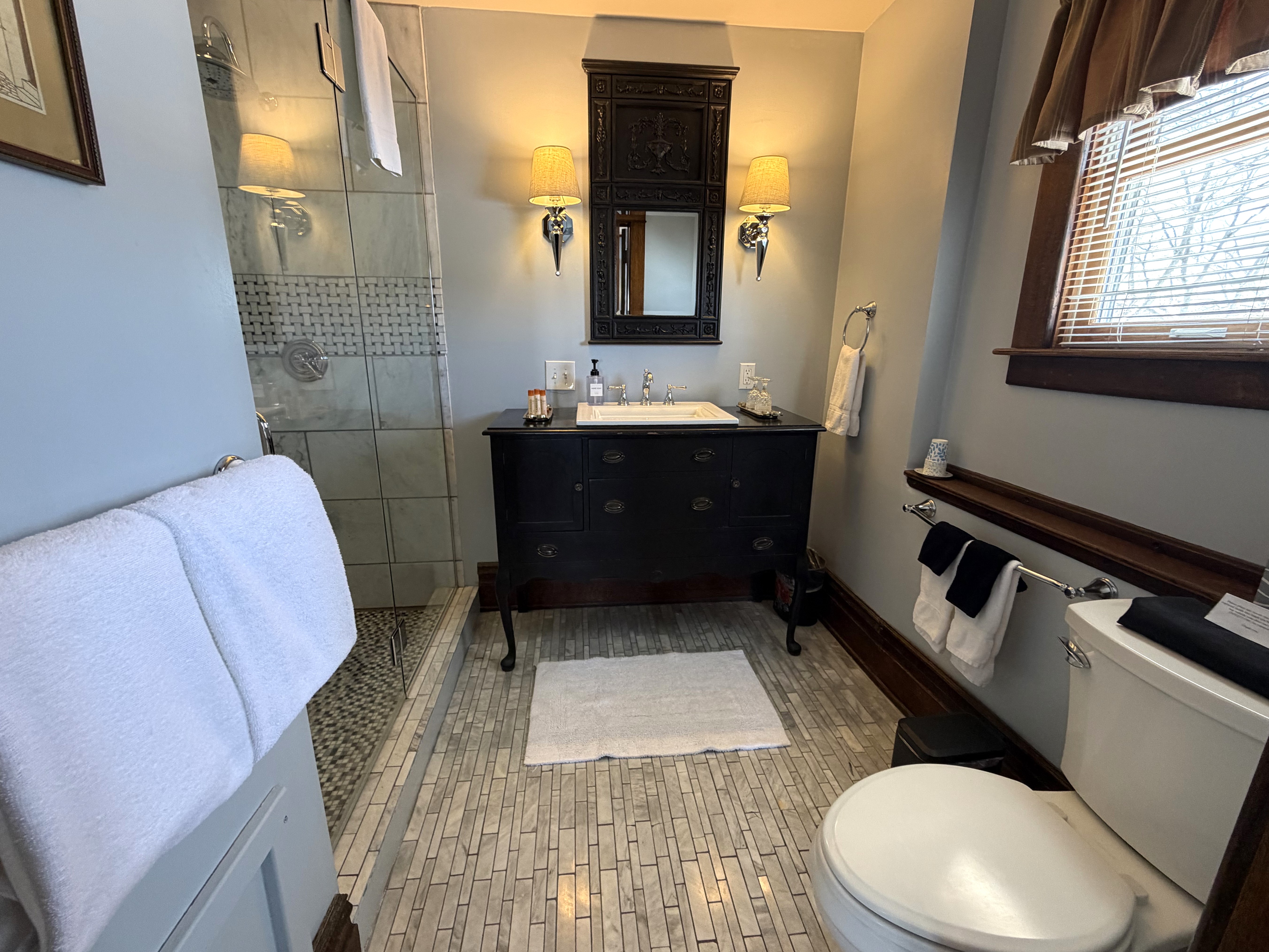 Ensuite bath with two person marble shower