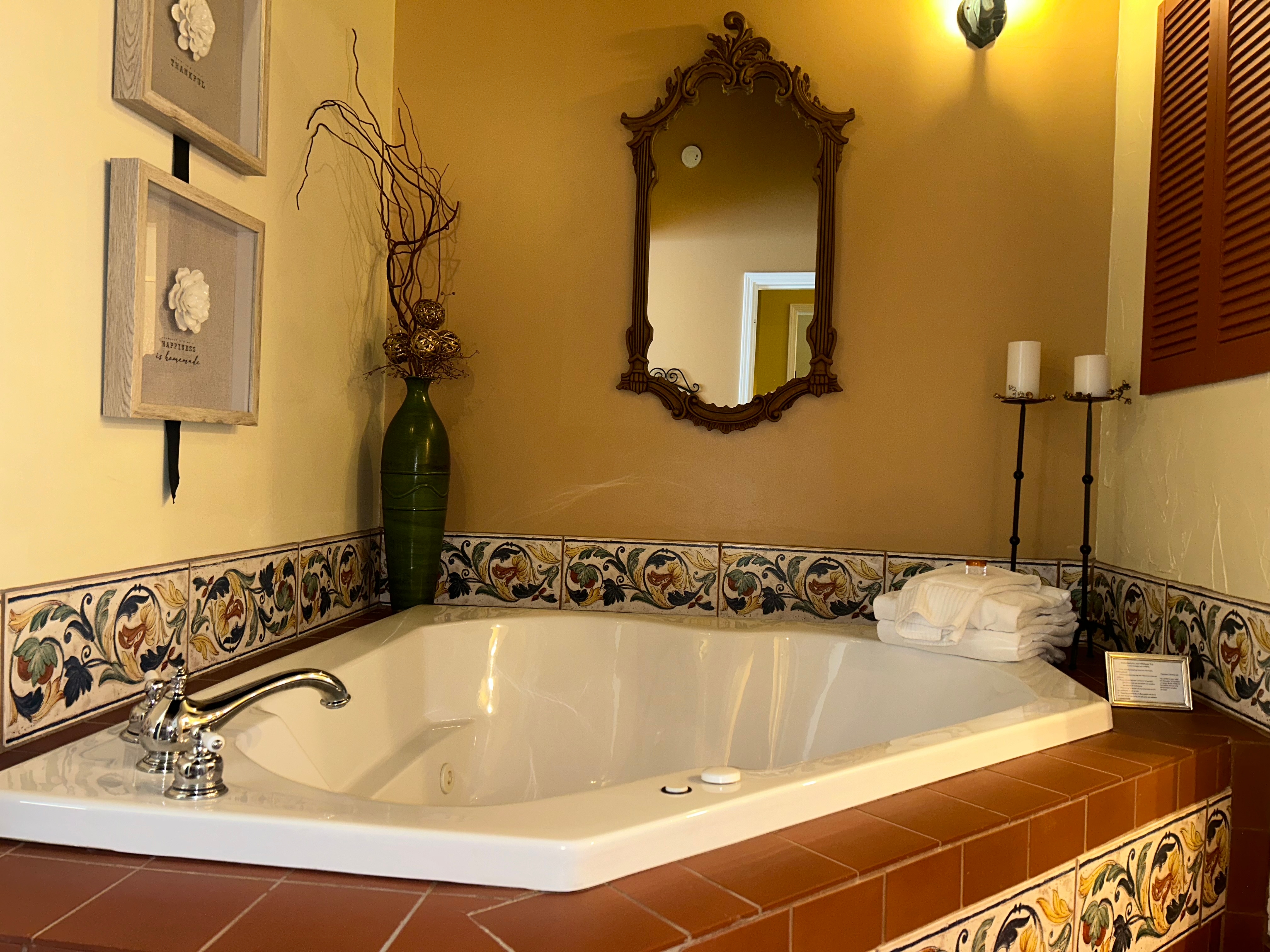 Suite with a two person jetted tub, candles, ensuite bath