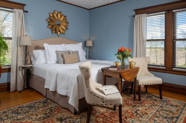 3 room Suite with king bed, table/chairs, breakfast tray, sitting area, wood burning fireplace