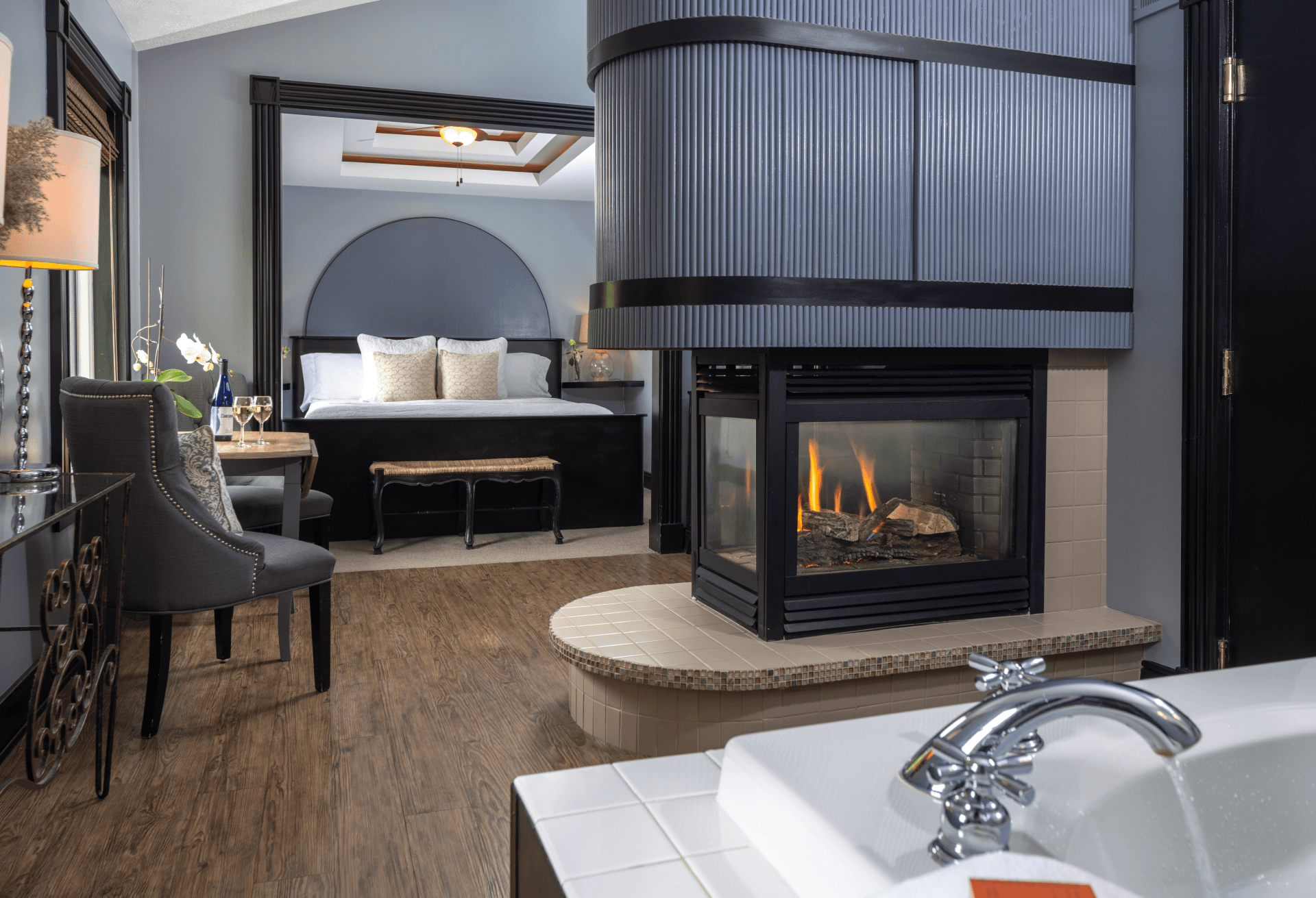 Sir Lancelot Suite with fireplace, king bed, and soaking tub at Castle in the Country in Allegan, Michigan.