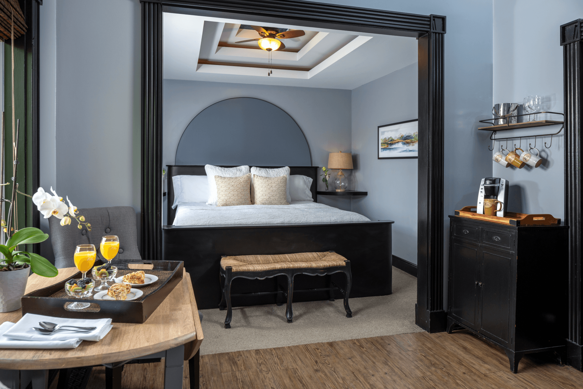 Sir Lancelot Suite king bed with breakfast tray and coffee station at Castle in the Country, Allegan MI.