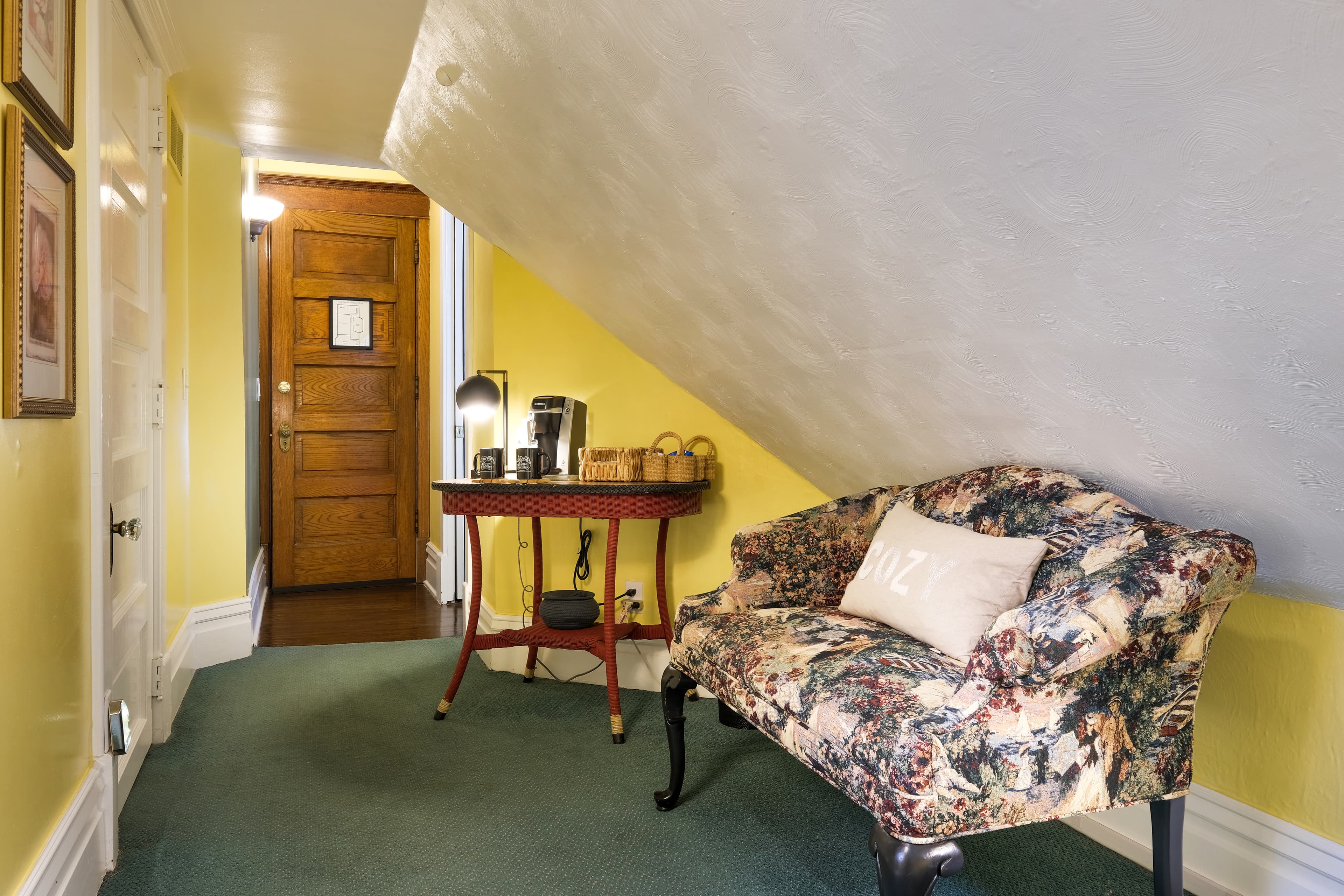 Sitting area with couch and coffee station