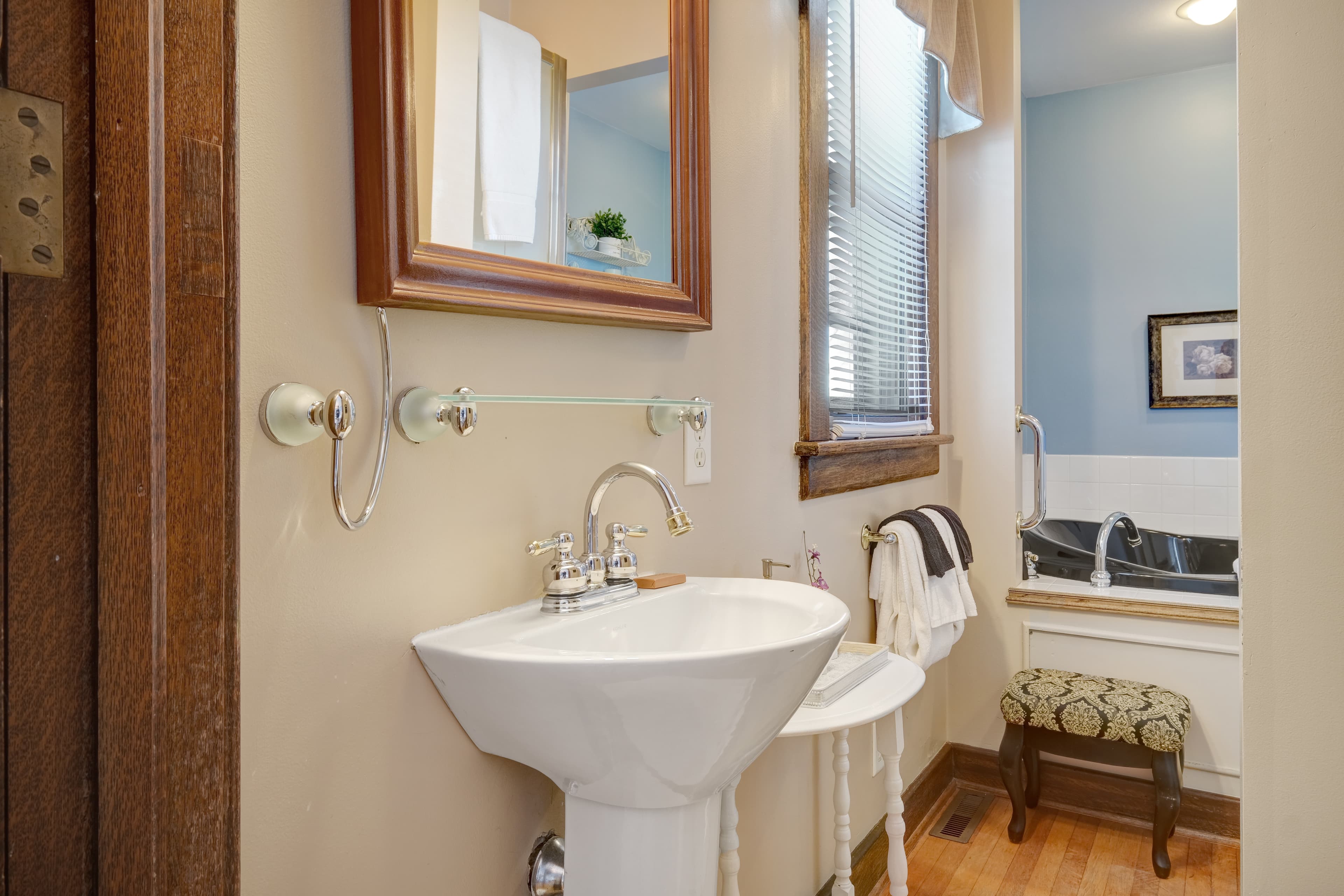 Ensuite bath with 2 person jetted tub, single person shower and pedestal sink