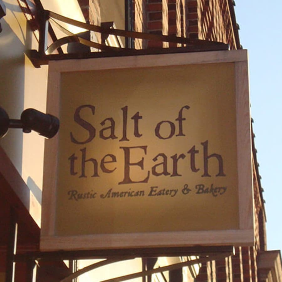 Sign for "Salt of the Earth: Rustic American Eatery & Bakery."
