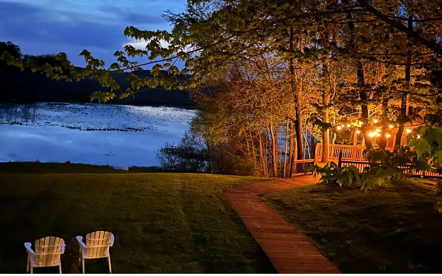 lighted gazebo and pond during evening in spring lighted gazebo and pond during evening in spring