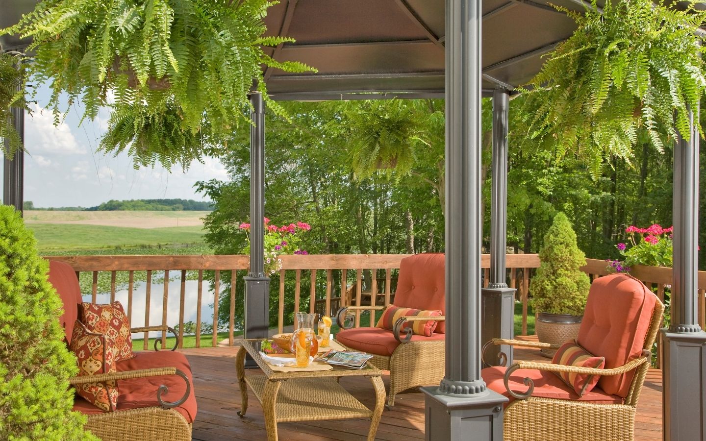 Gazebo by the water with tables and chairs