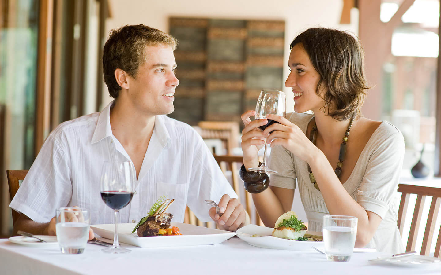 Michigan restaurant couple dining at table with wine