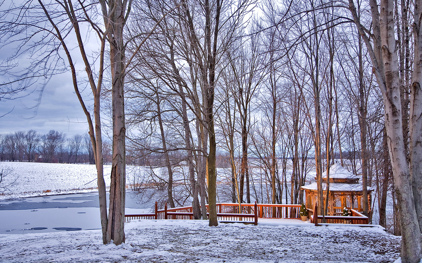 Gazebo, grounds and lake covered in snow