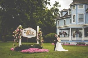wedding couple by Castle sign