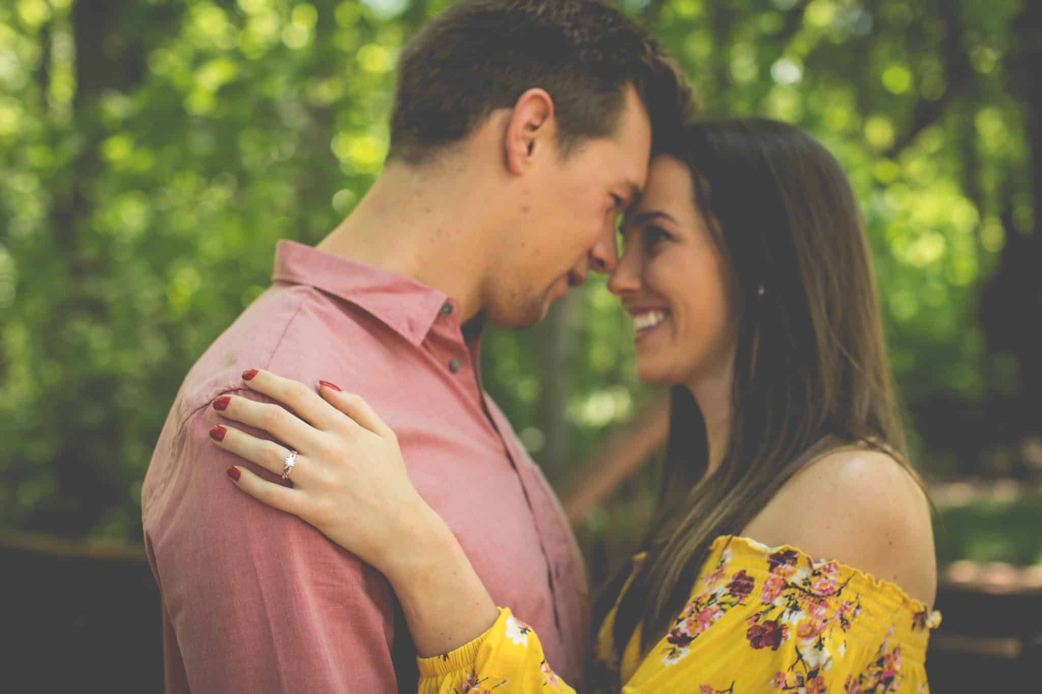 Couple embrace after engagement